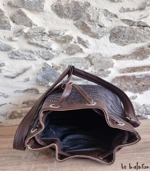 Brown ethnic bucket bag in Manjak woven loincloth